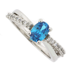 Oval Cut Blue Topaz Crossed Silver Ring