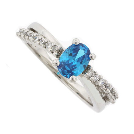 Oval Cut Blue Topaz Crossed Silver Ring
